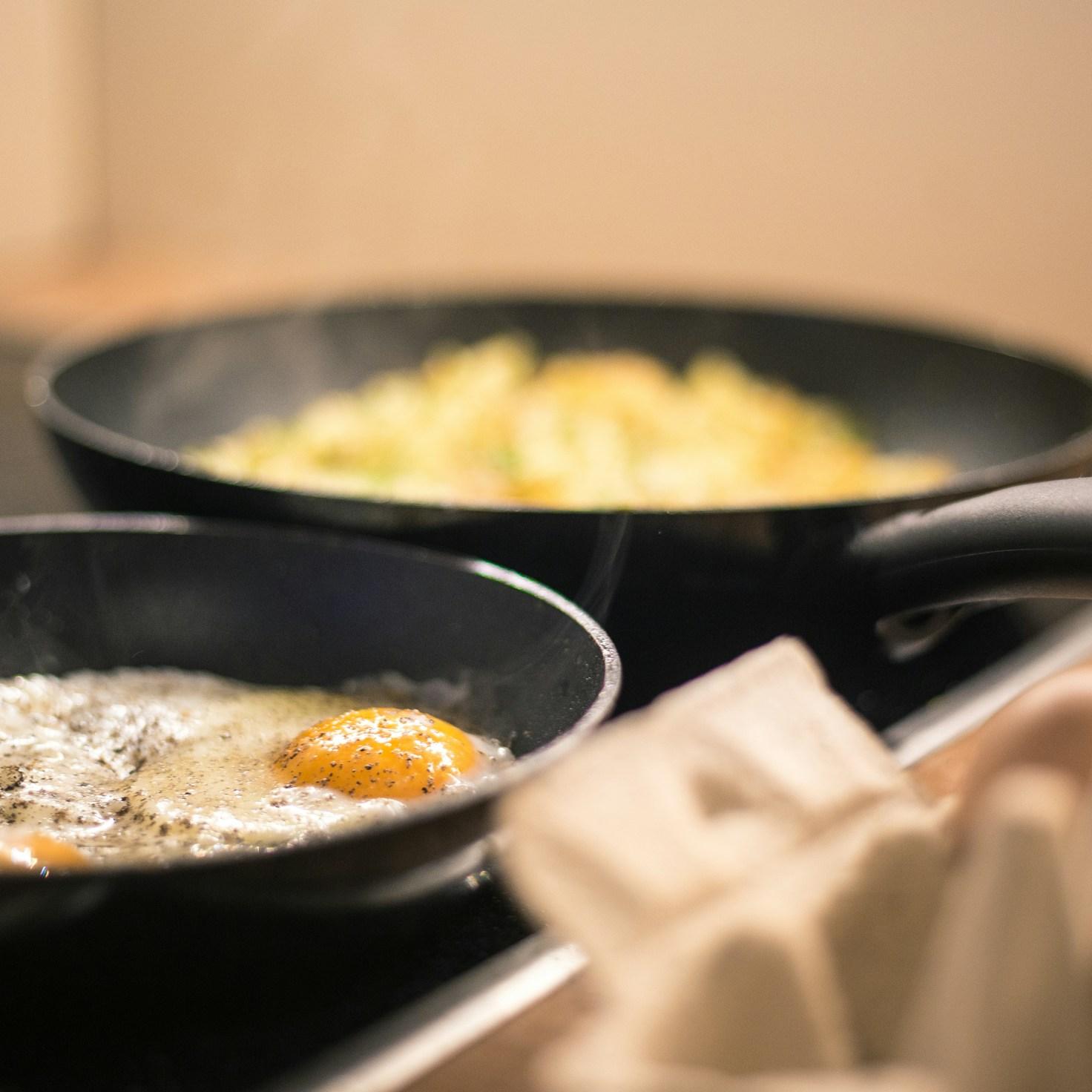 Diverse group of community members sharing a meal together, showcasing the social bonds formed through collaborative cooking